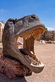 A T. rex head for taking souvenir photos of a person inside its mouth. Moab Giants Dinosaur Park near Moab, Utah.