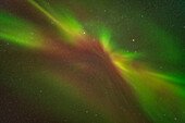 A zenith outburst of aurora overhead in mid-evening during an all-night display, from the Churchill Northern Studies Centre, in Churchill, Manitoba, on February 22, 2025. This was a brief coronal outburst that soon faded. The red object is Mars in Gemini. This shows some yellow from the blend of the red and green oxygen lines.
