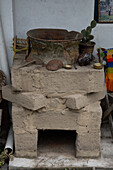 A vintage ceramic dye pot & stove at the Tahuantinsuyo Weaving Workshop, Otavalo, Ecuador.