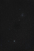 This telephoto lens image frames the two bright open star clusters in Cancer: M44, aka the Beehive, at top, and the smaller Messier 67 below, a fine cluster but often neglected in favour of its larger and brighter companion above. The field is 10º by 15º, so wider than but similar to that of binoculars and these clusters are both fine binocular targets.