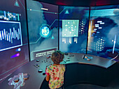 A young visitor pilots a UFO space ship in the International UFO Museum in Roswell, New Mexico.