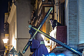 Seville, Spain, March 30 2018, Devotees watch from balconies as the Gran Poder procession moves through the streets of Seville during Holy Week, celebrating tradition.