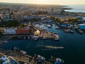 Aerial view of Porto Antico, the historic old port, the Marina and the old town, Monopoli, Italy