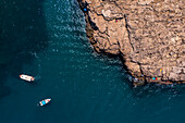 Aerial view of people enjoying the clear waters of Polignano a Mare, Puglia, Italy