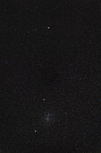 This telephoto lens image frames the bright open star cluster in Cancer, M44, aka the Beehive, below the fine double star Iota Cancri at top, aka the Springtime Albireo.