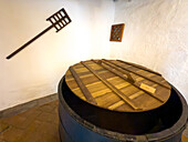 A wooden vat & paddle in the old brewery in the Convent of San Francisco, now a museum in Quito, Ecuador. Used in brewing beer.