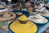 Cracked corn and other dry goods for sale in the open market in Otavalo, Ecuador.