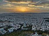 Aerial view of sunset over Athens with a beautiful skyline from Mount Lycabettus, Attica, Greece.