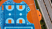 Aerial view of colorful sports court with patterns and geometric shapes, Umag, Croatia.
