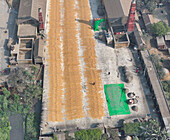 Aerial view of vibrant urban landscape with bustling activity and industrial buildings, Dhaka, Dhaka, Bangladesh.