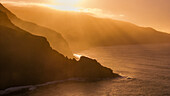 Aerial view of sunset over the sea and rugged mountains with a panoramic perspective, Barlovento town, Canary Islands, Spain.