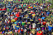 Bogura, Bangladesh - 27 November 2019: Aerial view of a bustling marketplace, where vibrant colors of produce contrast with the dark sacks, a dense tapestry of activity.