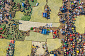 Bogura, Bangladesh - 27 November 2019: Aerial view of a bustling market scene unfolds, showcasing vibrant stalls, yellow crops, and a tapestry of human activity.