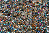 Aerial view of a bustling cattle market, where vendors and buyers converge amidst a sea of livestock in a vibrant display of trade, Mahasthan, Rajshahi Division, Bangladesh.