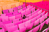 Araihazar, Bangladesh - 04 December 2020: Aerial view of vibrant fabrics dyeing workshop with colorful rows of cloth, Duptara, Araihazar, Dhaka, Bangladesh.