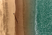 Aerial view of Kolatoli Beach with serene sandy shore and azure ocean waves, Cox's Bazar, Chattogram, Bangladesh.