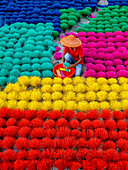Aerial view of colorful and vibrant drinking straw making activity with traditional artisans, Porsha, Naogaon, Rajshahi, Bangladesh.