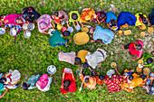 Bogura, Bangladesh - 12 March 2021: Aerial view of vibrant community gathering during a traditional Majlis public food offering with colorful clothing and shared meals, Sekherkola, Bogura, Rajshahi, Bangladesh.