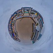 Aerial view of a tiny planet perspective of the historic Old Town with iconic buildings and a bridge over the river, Hull, England, United Kingdom.