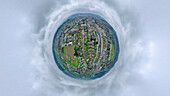Aerial view of a tiny planet perspective of Zofingen city with beautiful clouds and scenic countryside, Aargau, Switzerland.