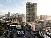Aerial view of modern skyscrapers and residential buildings with bustling streets and traffic, Edgewater, Florida, United States.