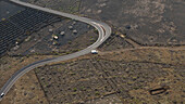 Aerial view of a beautiful vineyard with dry stone walls and a winding road, Haria town, Canary Islands, Spain.