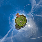 Aerial view of a tiny planet perspective featuring a vibrant landscape with a tower surrounded by grass and trees under a blue sky with clouds, Hull, England, United Kingdom.