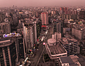 Aerial view of beautiful modern skyline at sunset with highrise buildings and bustling streets, Dhaka, Dhaka, Bangladesh.