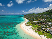 Aerial view of beautiful Lanikai beach with turquoise ocean and lush mountains, Kailua, Hawaii, United States.