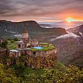 Aerial view of Tatev Monastery on the rocks, a monastery complex with view over the valley and mountains, Tatev, Syunik Province, Armenia.