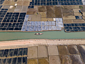 Aerial view of beautiful agricultural fields and tranquil canals with boats, Banshkhali, Bangladesh.