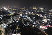 Aerial view of the city lights illuminating the night sky over buildings and roads, a stunning display of urban vibrancy, Lagos, Lagos, Nigeria.
