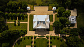Aerial panoramic view of Palace of Uzutrakis with elegant architecture and meticulously manicured grounds, framed by lush greenery and the serene waters, Trakai, Vilnius country, Lithuania.