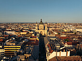 Aerial view of the magnificent St. Stephen's Basilica rises majestically above the cityscape, its dome gleaming under the soft light, Budapest, Budapest, Hungary.