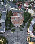 Aerial view of the striking circular architecture of the Meskhishvili Theatre, a cultural beacon amidst the city's vibrant urban tapestry, Kutaisi, Imereti, Georgia.