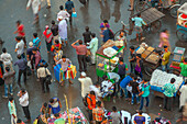 Dhaka, Bangladesh - 13 September 2015: Aerial view of bustling crowds and vibrant stalls create a tapestry of life, movement, and commerce in the heart of the city.