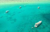 Aerial view of yachts and boats resting on the turquoise waters of the Red Sea, a serene vista of leisure and maritime beauty, Gouna, Red Sea Governorate, Egypt.