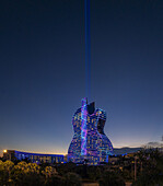 Hollywood, Florida, United States - 14 August 2025: Aerial view of the Seminole Hard Rock Hotel Guitar, its vibrant lights cutting through the twilight sky, a glowing beacon against the darkening horizon.