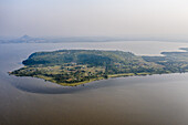 Aerial view of an island embraced by the vast lake, its lush greenery contrasting with the surrounding waters, dotted with buildings, Homa Bay, Homa Bay, Kenya.