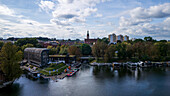 Aerial view of the river reflecting the sky, old buildings, and the cathedral tower rising above the skyline, Bydgoszcz, Województwo kujawsko-pomorskie, Poland.