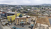 Aerial view of a mosque with its green dome amidst the urban sprawl, a testament to faith and community, Old Bodija, Oyo, Nigeria.