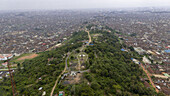 Aerial view of Bower's Tower atop Oke Are in the foreground, contrasting with the expansive cityscape beyond, Ibadan North-West, Oyo, Nigeria.