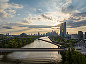 Aerial view of the Main River reflecting the sky as it winds past the European Central Bank and the city's skyscrapers, Frankfurt am Main, Hessen, Germany.