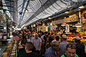 Jerusalem, Israel - 01 November 2019: View of the vibrant Mahane Yehuda Market bustling with shoppers amidst a kaleidoscope of colors and textures, from fresh produce to baked goods.