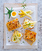 Focaccia canapés with egg and white asparagus