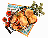 Stuffed focaccia sandwiches with tomatoes and oregano