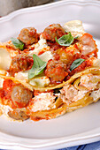 Pancake casserole with meatballs, mozzarella and basil