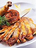 Breast and leg of capon with endive tartlets