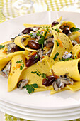 Stracci con alici (fresh pasta with anchovies and olives, Italy)