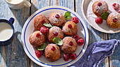 Bomboloni with raspberries and raspberry jam